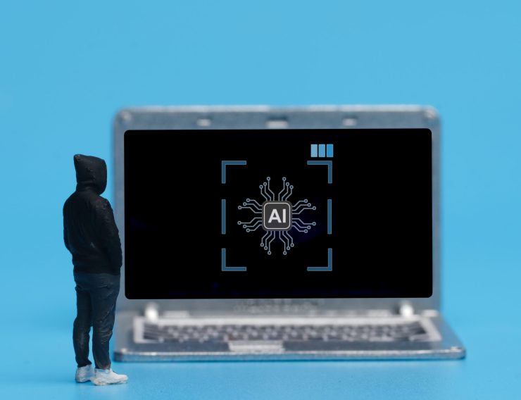A picture of men miniature with laptop with artificial intelligence sign